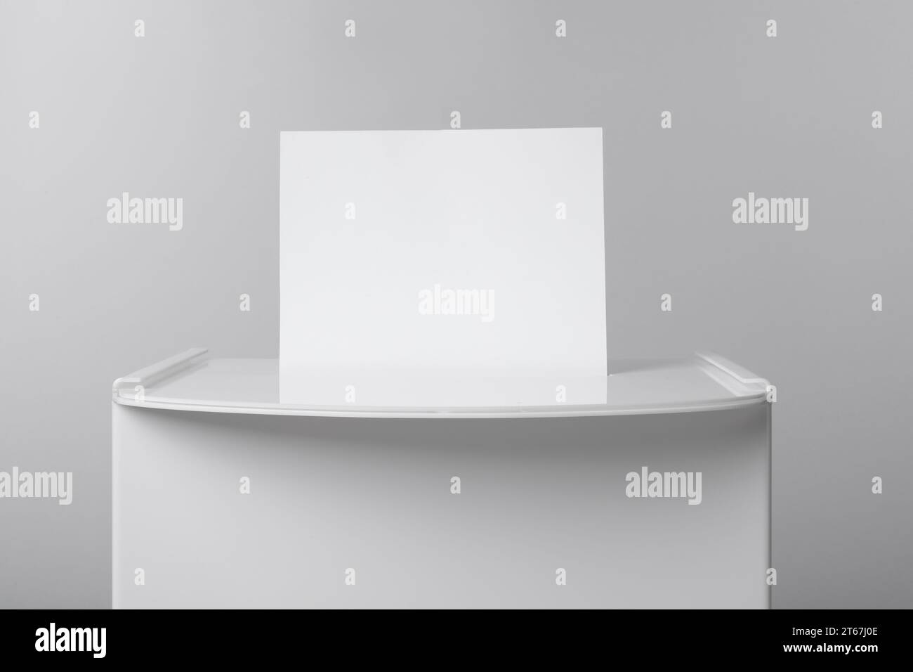 Ballot box with vote on light grey background, closeup. Election time ...