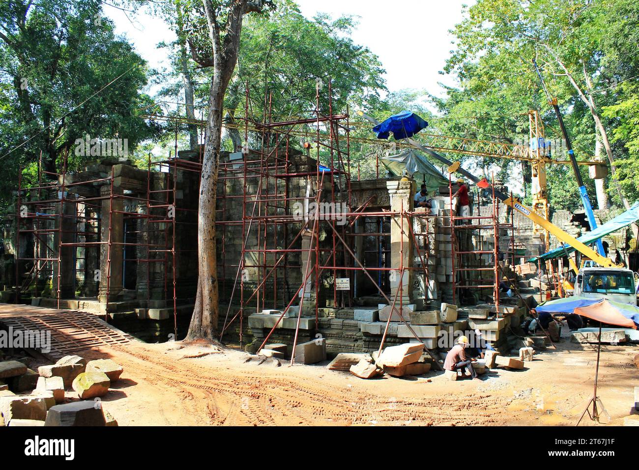 Reconstruction efforts continue nonstop among the ruins in the Angkor Archaeological Park, Cambodia. The ancient temple complex covers some 400 acres Stock Photo