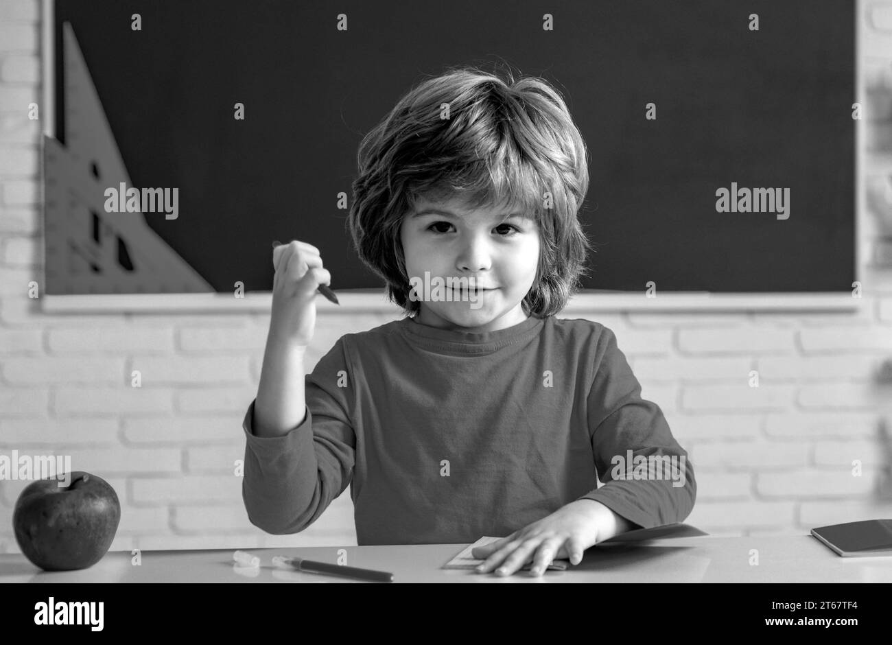 Little ready to study. Education. Little student boy happy with an excellent mark. Pupil learning letters and numbers. Stock Photo