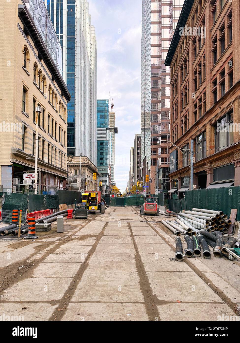 Construction material by the Hudson Bay Store (right). Closure of Queen Street in the downtown district for the construction of the Ontario Line. Stock Photo