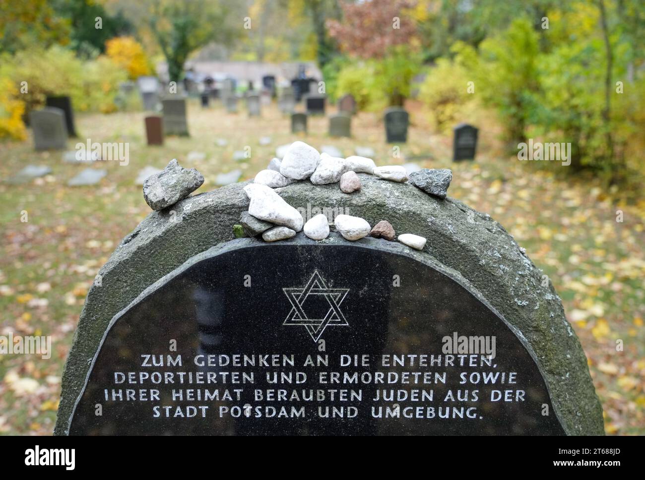 Potsdam, Germany. 09th Nov, 2023. A gravestone with the inscription "In memory of the dishonored, deported and murdered Jews from the city of Potsdam and the surrounding area who were robbed of their homes" stands in the Jewish cemetery before the start of a commemorative event to mark the 85th anniversary of the pogrom night in Brandenburg. Credit: Soeren Stache/dpa/Alamy Live News Stock Photo