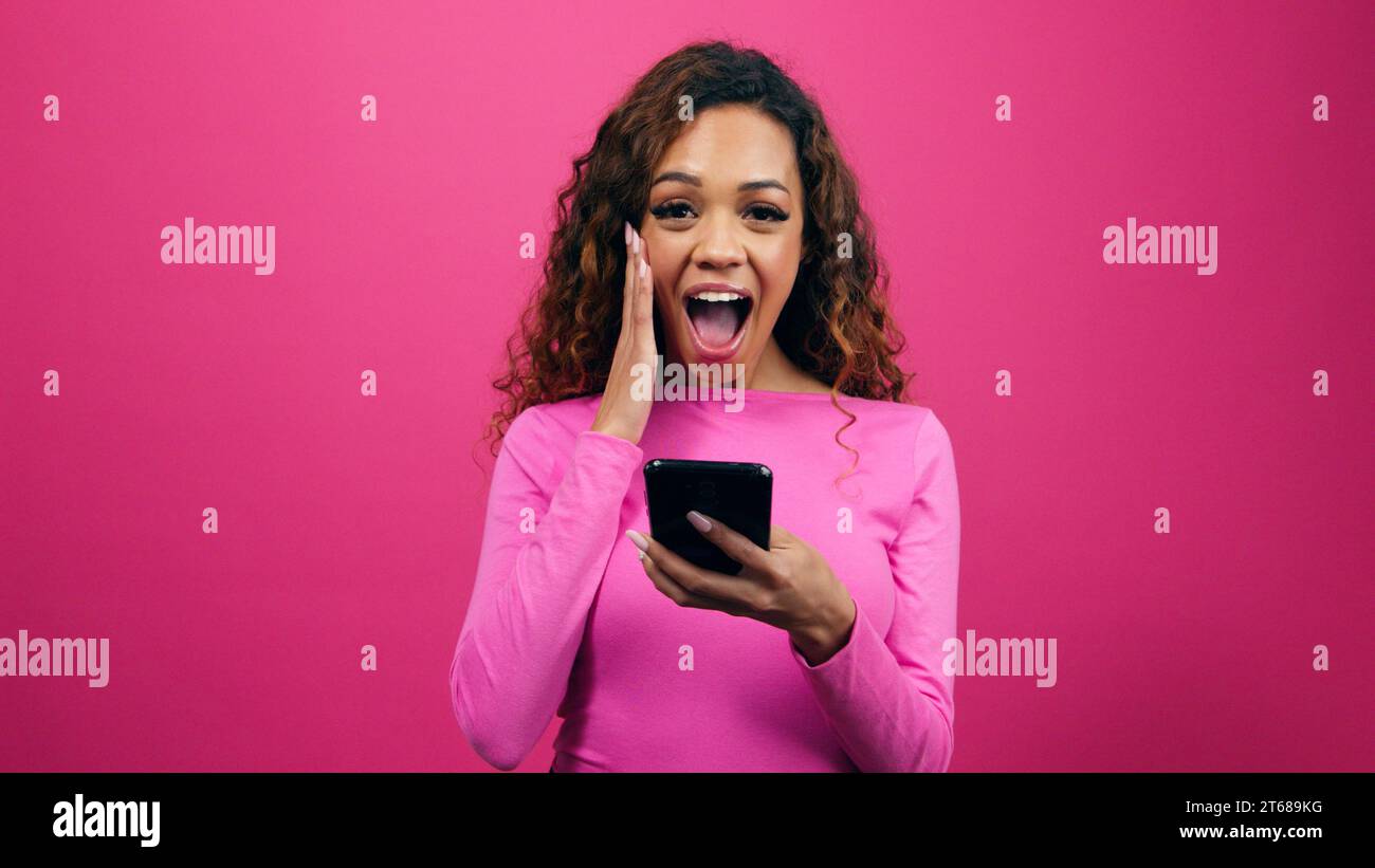 Shocked young woman gets successful hi-res stock photography and images ...