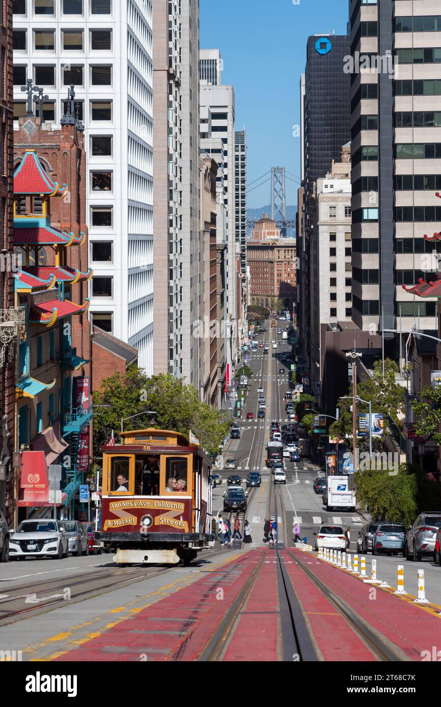 San Francisco, California - April 26, 2023: Surface level of road markings on diminishing tramway leading towards modern buildings Stock Photo