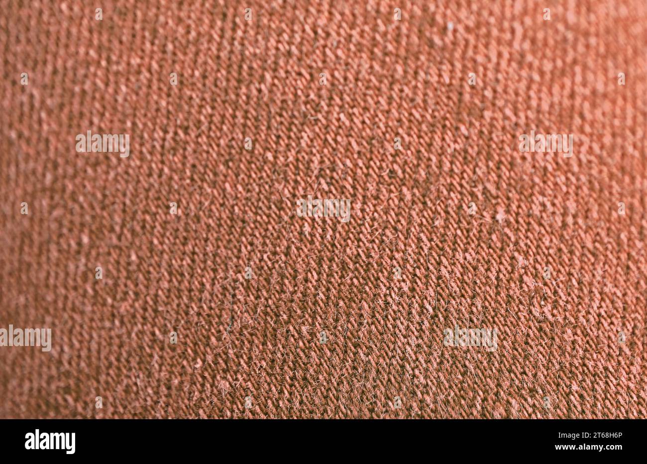 Closeup of Red Brown Colored Jeans Fabric Texture with Selective Focus Stock Photo