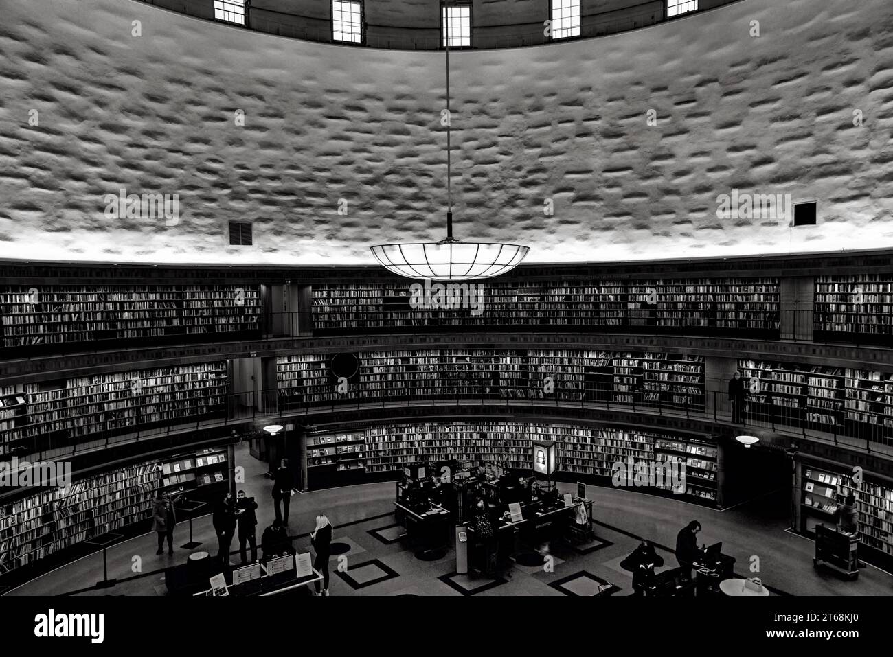 An atmospheric black and white image of a large library in Stockholm