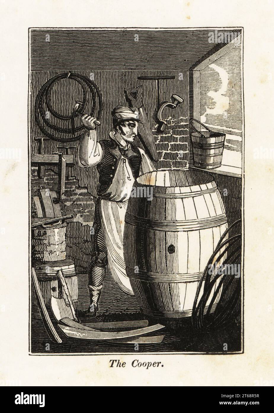 Cooper in apron hammering a metal hoop on a hogshead barrel with a mallet in a workshop. Hoops, saws, spoke-shave, stock and bit, adze and auger on the walls, wooden planks on the floor. Woodblock engraving from The Book of English Trades, or Library of Useful Arts, F.C.& J. Rivington, London, 1821. Stock Photo