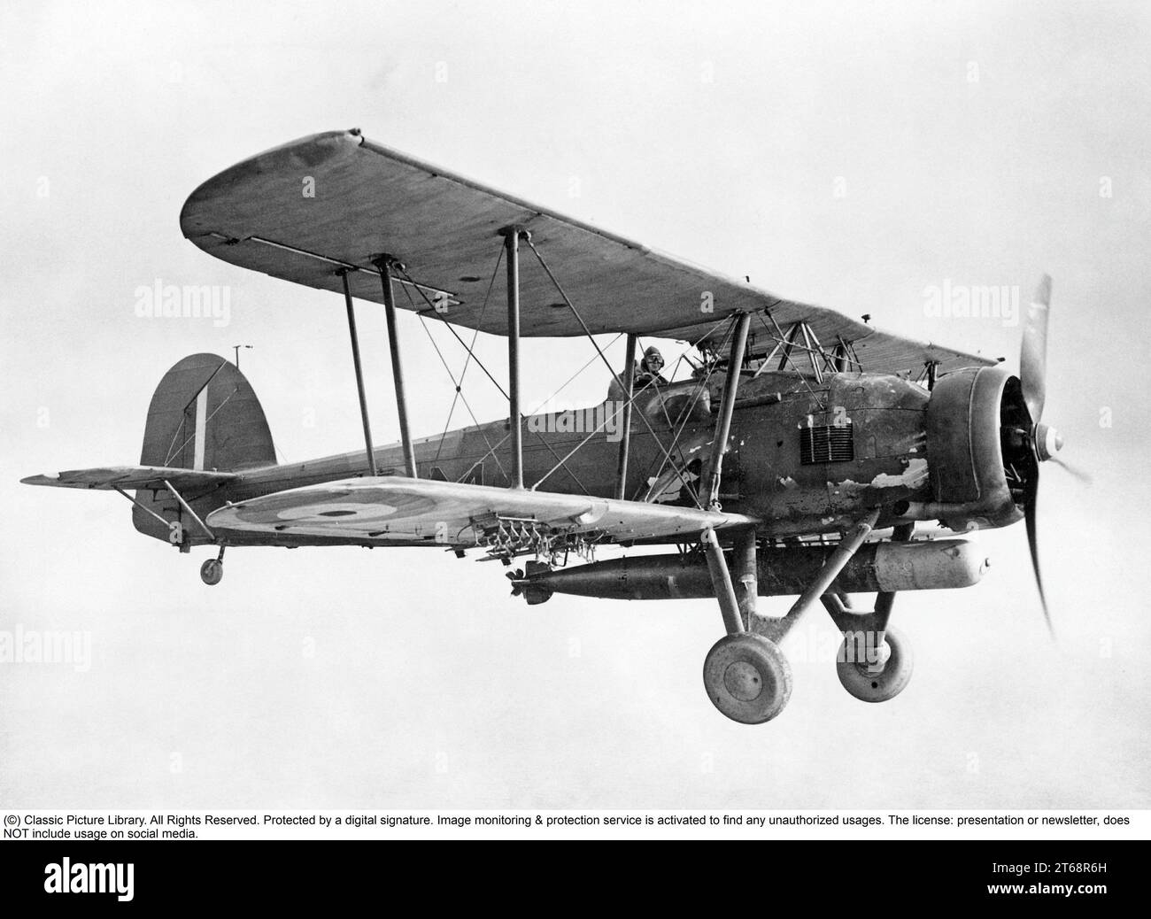 Fairey Swordfish Mk I with 785 Naval Air Squadron, Fleet Air Arm, 1939-45. The Fairey Swordfish was a biplane torpedo bomber, nicknamed “Stringbag,” that primarily served with the Fleet Air Arm (FAA) of the British Royal Navy during the Second World War. While outdated by 1939, the Swordfish went on to have an impressive wartime record, including sinking a larger tonnage of Axis shipping than any other Allied aircraft and famously playing a role in the sinking of the German battleship Bismarck. Stock Photo
