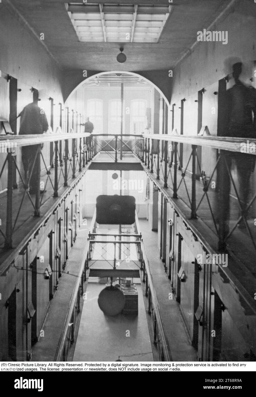 Inside a prison 1930s. The inside of Långholmens central prison in Stockholm showing the cells and doors on the different floors. Sweden 1935 Stock Photo