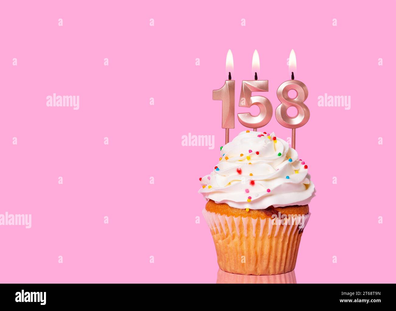 Birthday Cake With Candle Number 158 - On Pink Background. Stock Photo