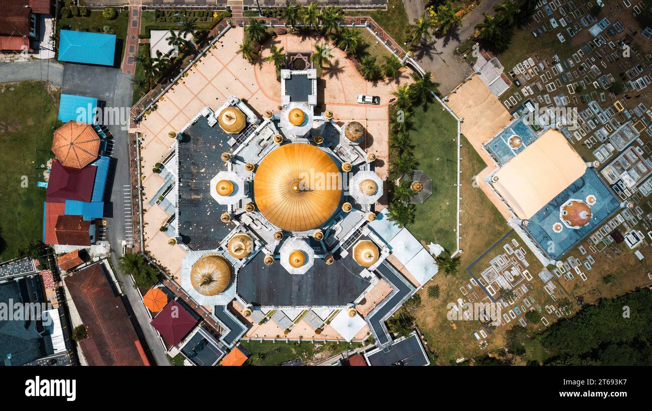 An aerial view of a majestic mosque surrounded by lush vegetation Stock ...