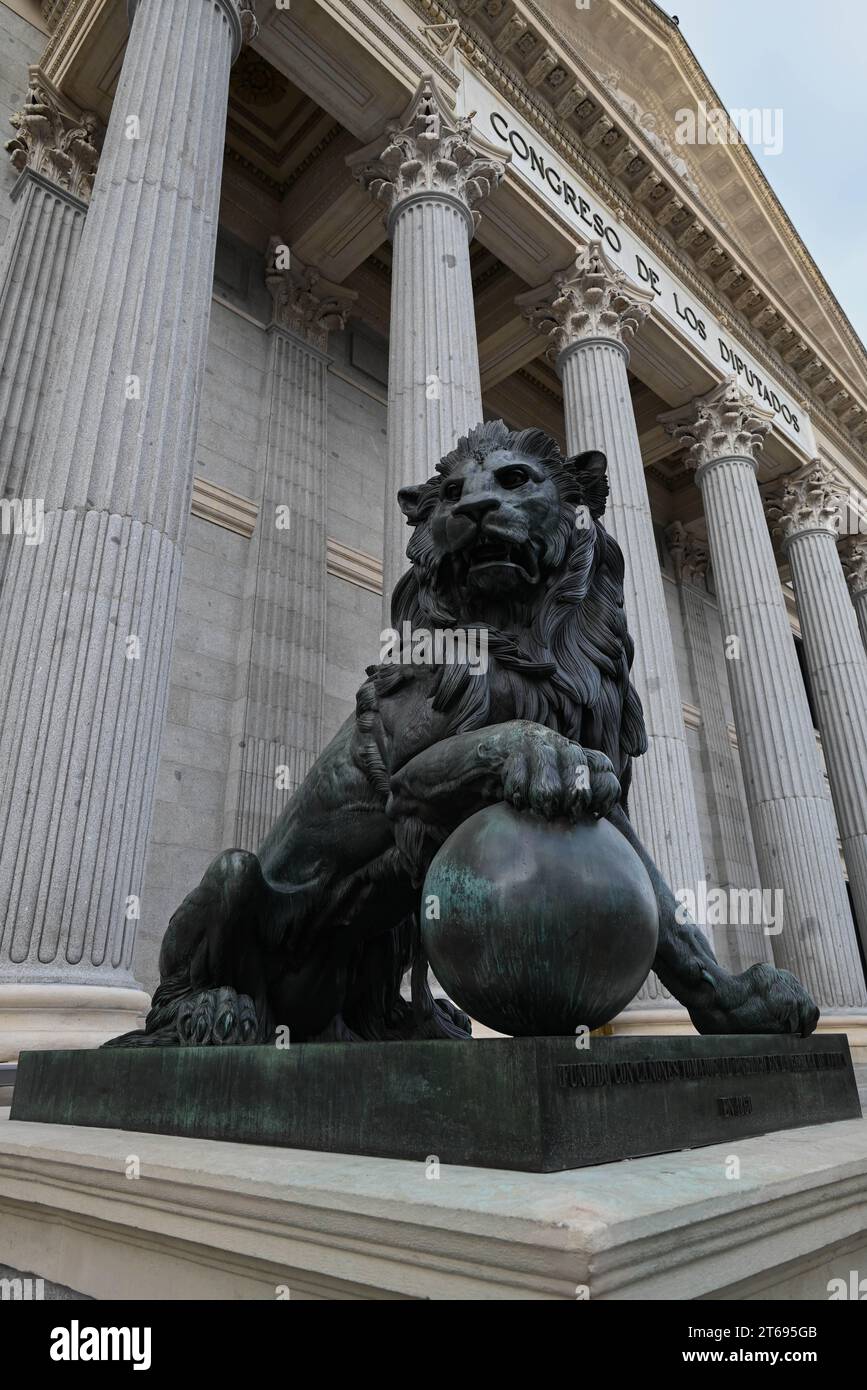 A majestic black lion statue standing tall in the courtyard of the ...