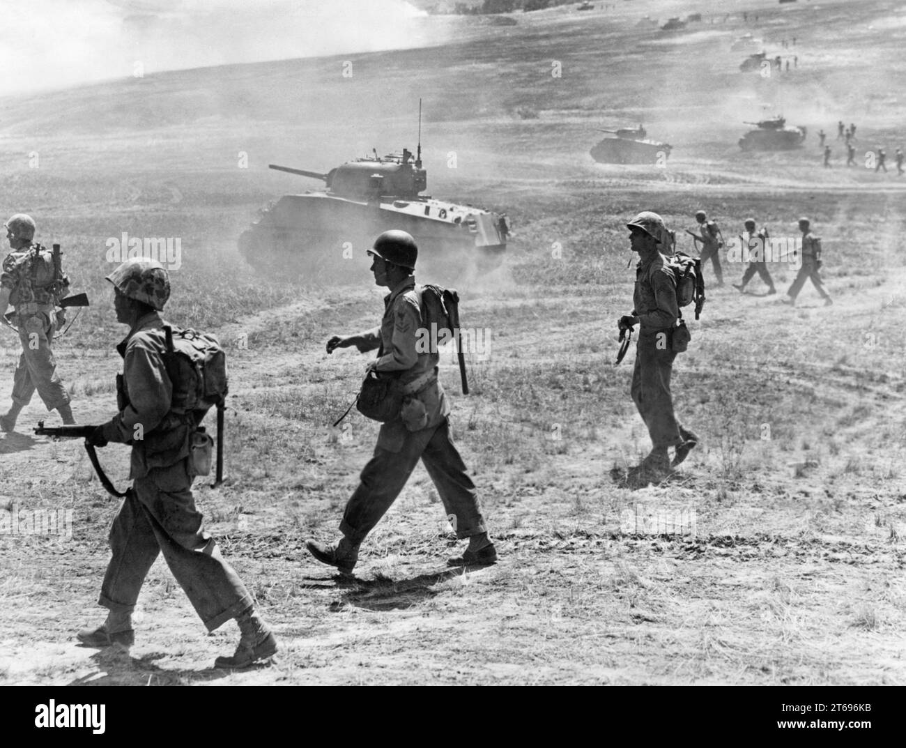 American Marines and Sherman tanks attacking Japanese position near Okinawa capital, Naha. [automated translation] Stock Photo