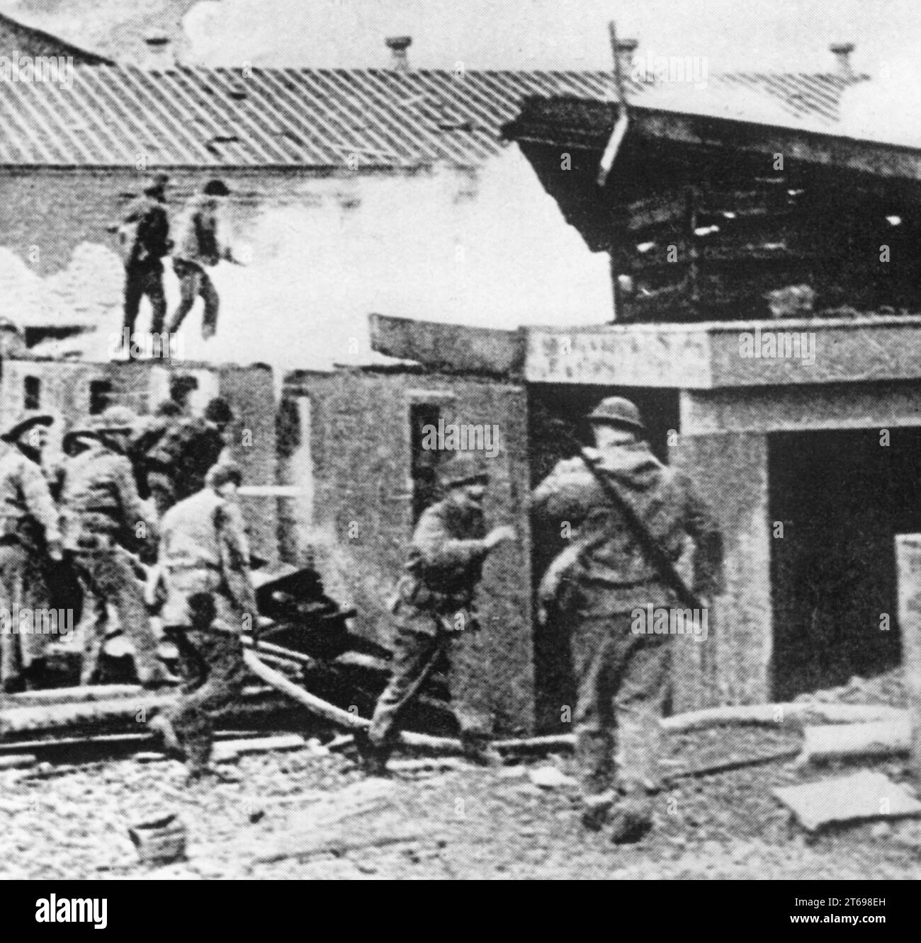 American soldiers during fire-fighting operations after an attack by Japanese aircraft on Dutch Harbor on Unalaska Island in the Aleutian Islands, which belongs to the United States. [automated translation] Stock Photo