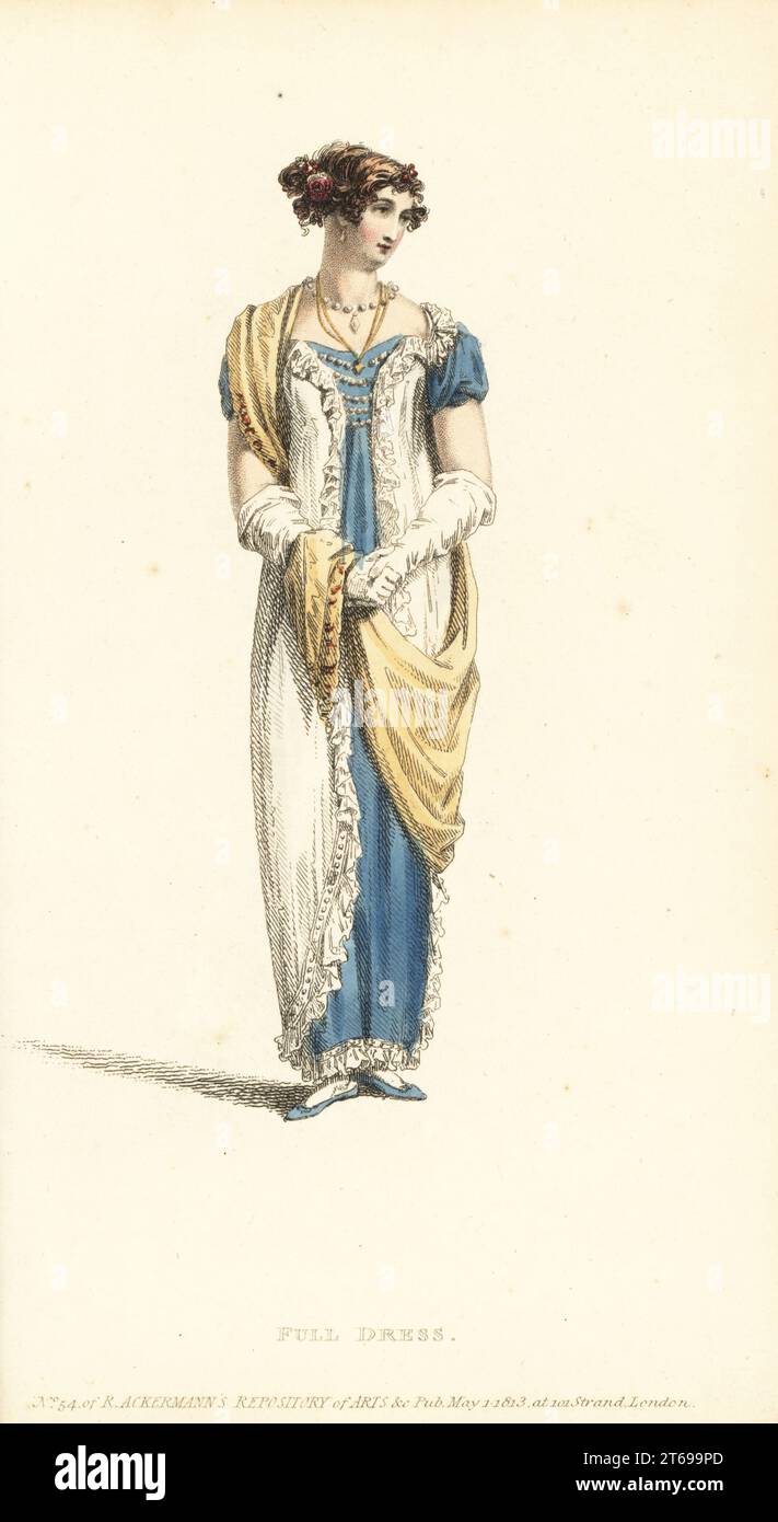 Regency woman in full dress. Evening dress of Polonese robe in white crepe over a celestial blue satin slip, hair in the Eastern style with flowers, Grecian scarf, French kid gloves, blue satin slippers. Plate 37, Vol. 9, May 1, 1813. Handcoloured copperplate engraving by Thomas Uwins from Rudolph Ackermann's Repository of Arts, London. Stock Photo