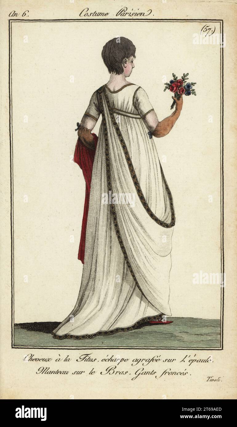 Fashionable woman in short Titus haircut at Tivoli Gardens, 1798. She has a short Titus cut, a version of the Victim, and wears a scarf fastened at the shoulder. She holds a mantle draped over her left arm, and wears gathered gloves. Model seen at the pleasure gardens at the Jardin de Tivoli. Cheveux à la Titus, echarpe agrafée sur l'épaule. Manteau sur le bras, gants froncés. 22 August 1798. Handcoloured copperplate engraving from Pierre de la Mesangeres Journal des Modes et Dames, Paris, 1798. The illustrations in volume 1 were by Carle Vernet, Claude Louis Desrais and Philibert Louis Debuco Stock Photo