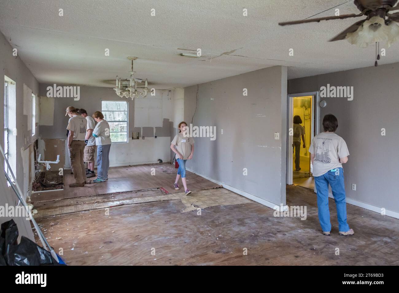 Team of volunteers with 8 Days of Hope faith based charity assessing the required repairs to a home that was flooded in Houston, Texas Stock Photo