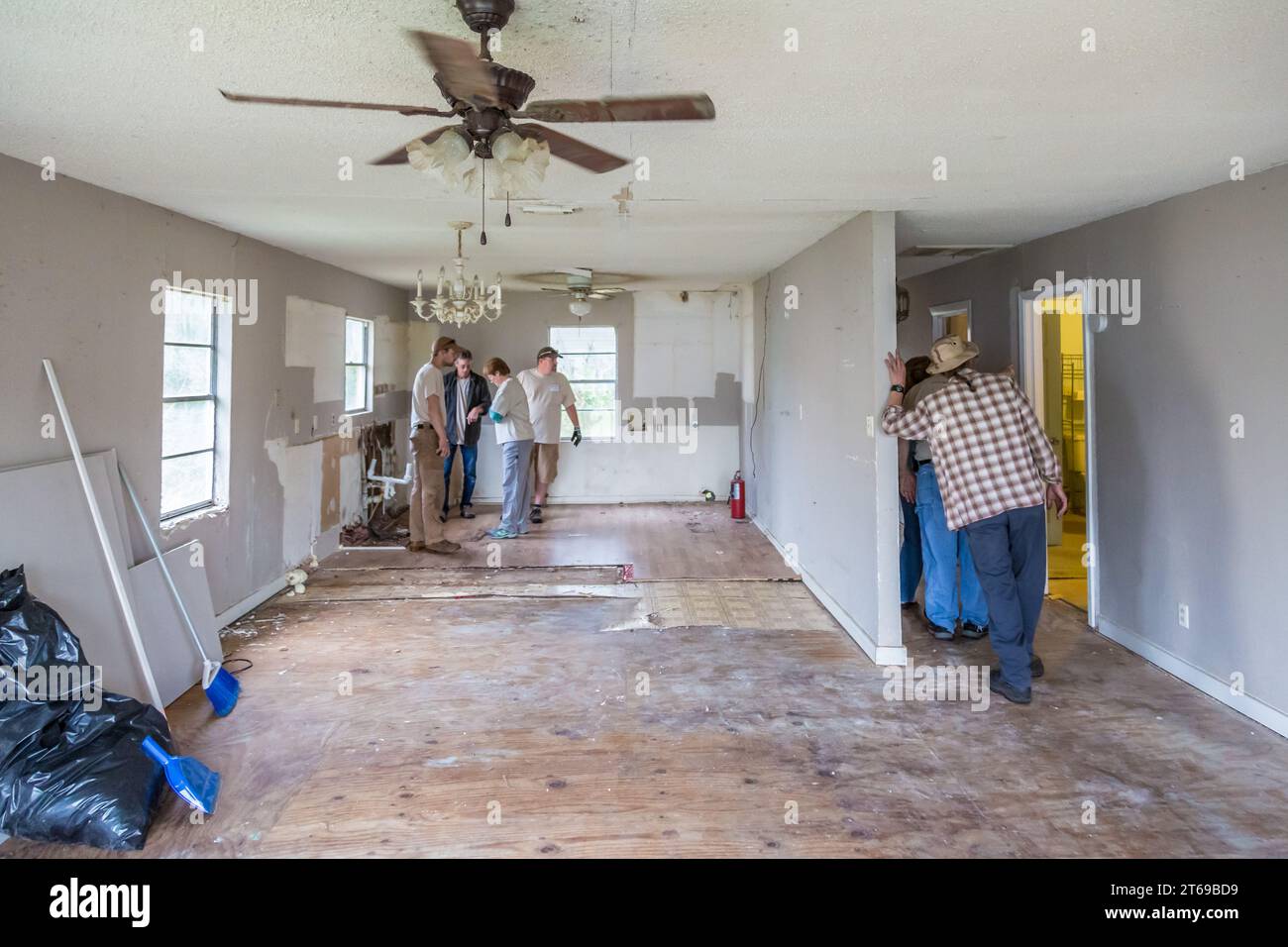 Team of volunteers with 8 Days of Hope faith based charity assessing the required repairs to a home that was flooded in Houston, Texas Stock Photo