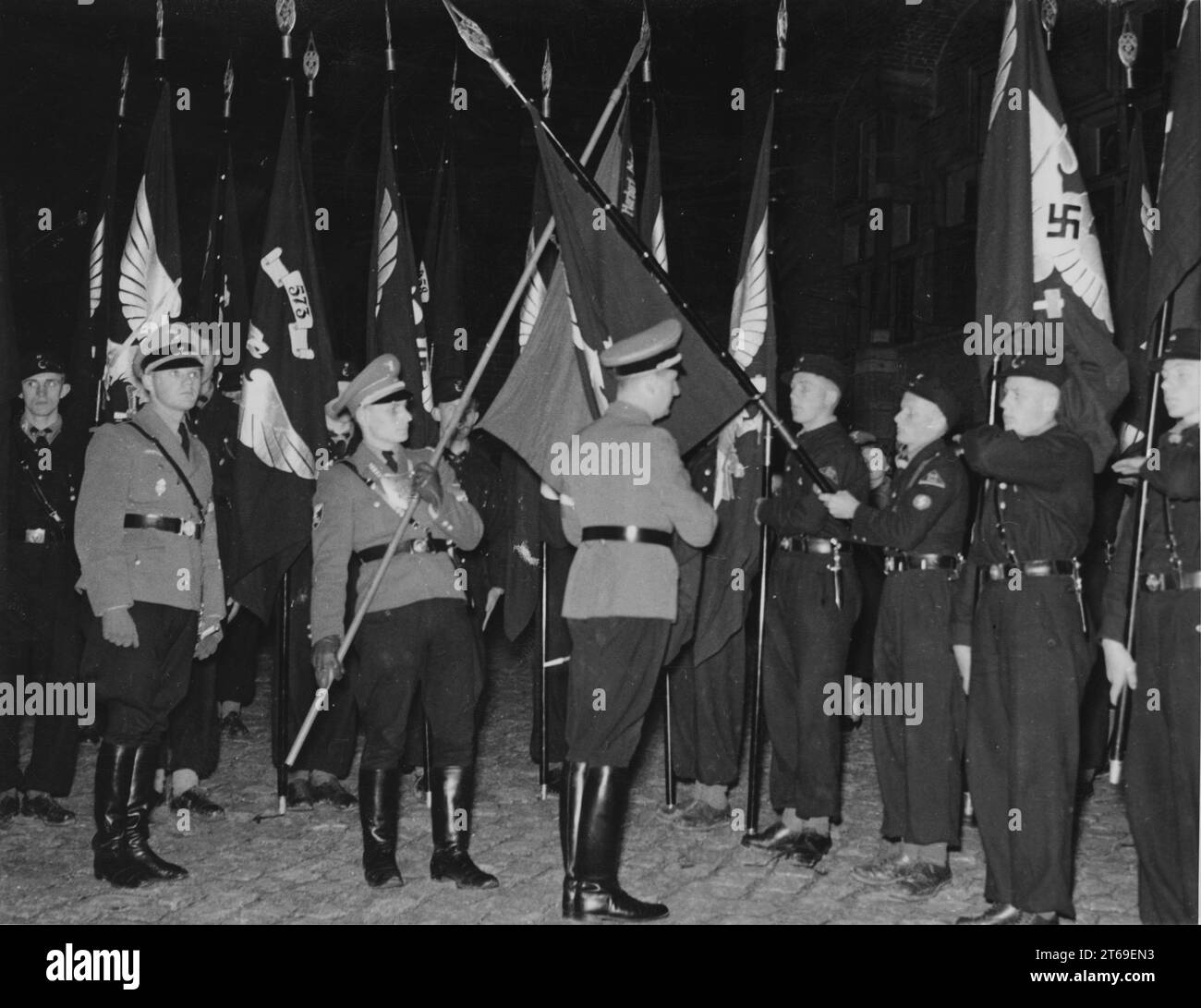 Baldur von Schirach consecrates Jungbann flags from Austria and the Sudetenland at Marienburg Castle in East Prussia by touching the Herbert Norkus flag. [automated translation] Stock Photo