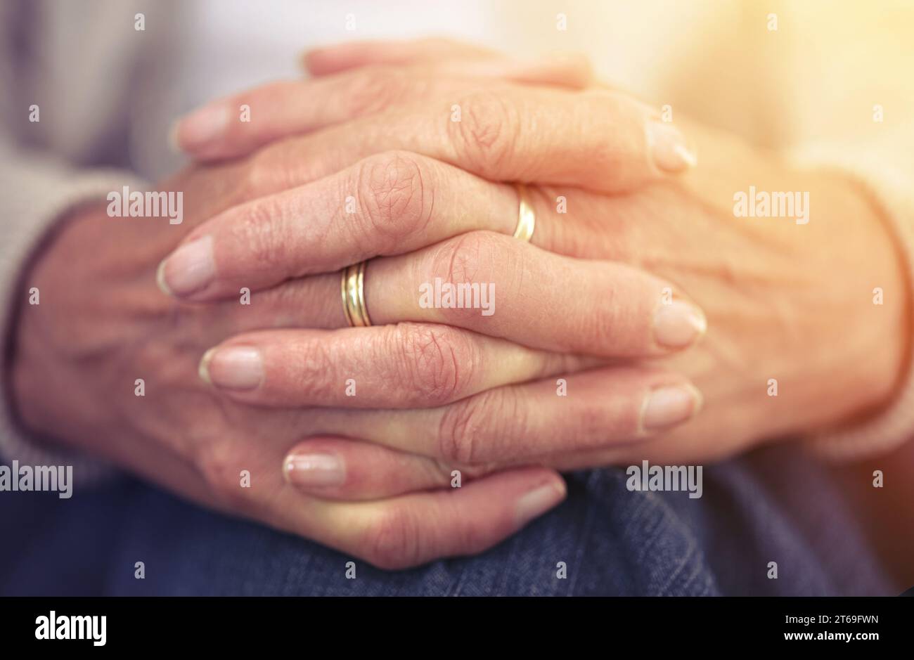 Hands, retirement and nostalgia with a senior woman closeup indoor thinking about a past memory. Fingers, wrinkles and old age with a mature female Stock Photo