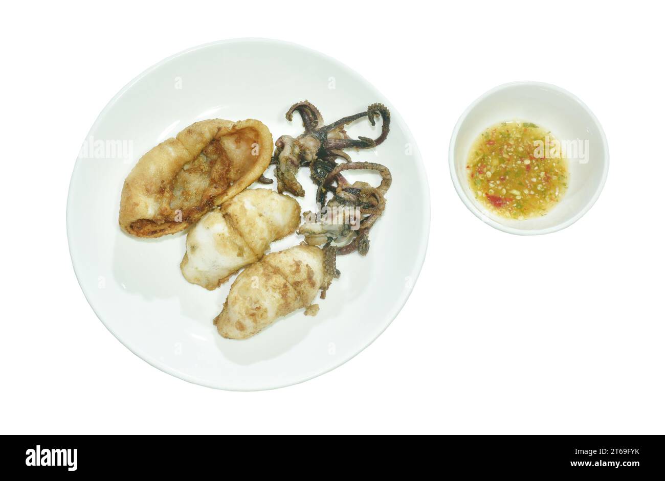 crispy fried squid with garlic dipping spicy chili sauce on plate Stock