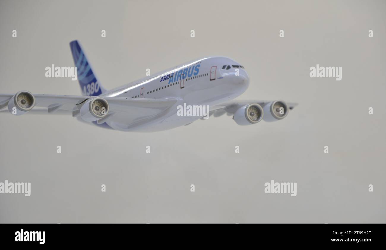 A380 model aircraft with white and blue paintwork. White background and base. Negative space. top-down view Stock Photo