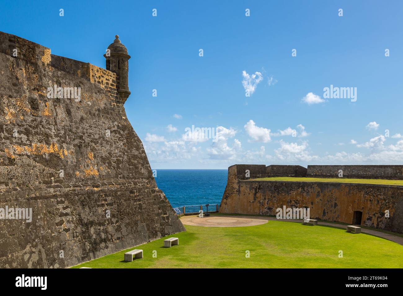 Benches and a green lawn inside Castillo San Cristobal fort in San Juan, Puerto Rico Stock Photo