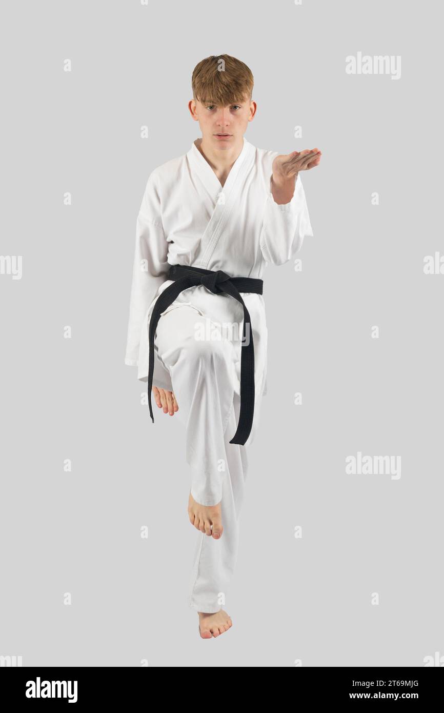Black belt teenage boy performing kata Stock Photo