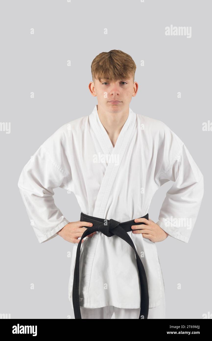 Black belt teenage boy with his hands on his hips Stock Photo Alamy