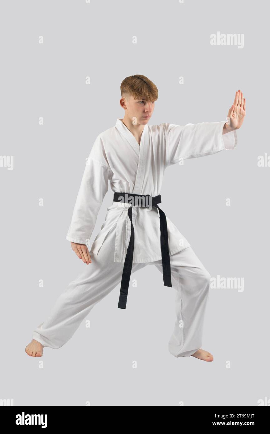 Black belt teenage boy performing a kata Stock Photo Alamy