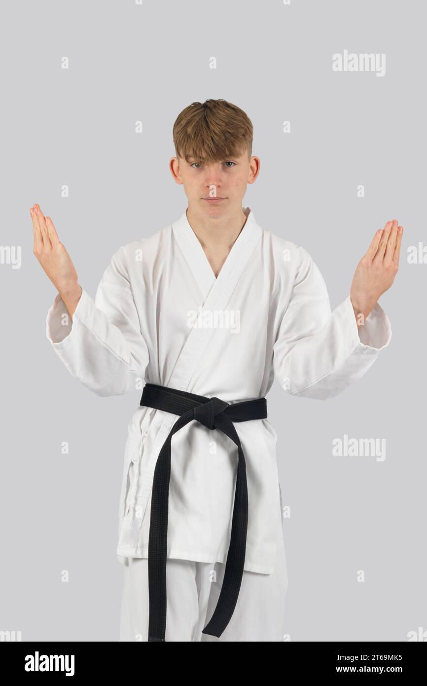 Black belt teenage boy performing a kata Stock Photo
