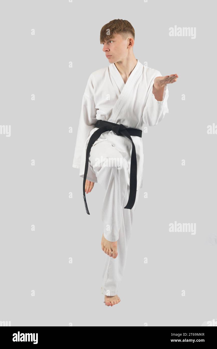 Black belt teenage boy performing kata Stock Photo