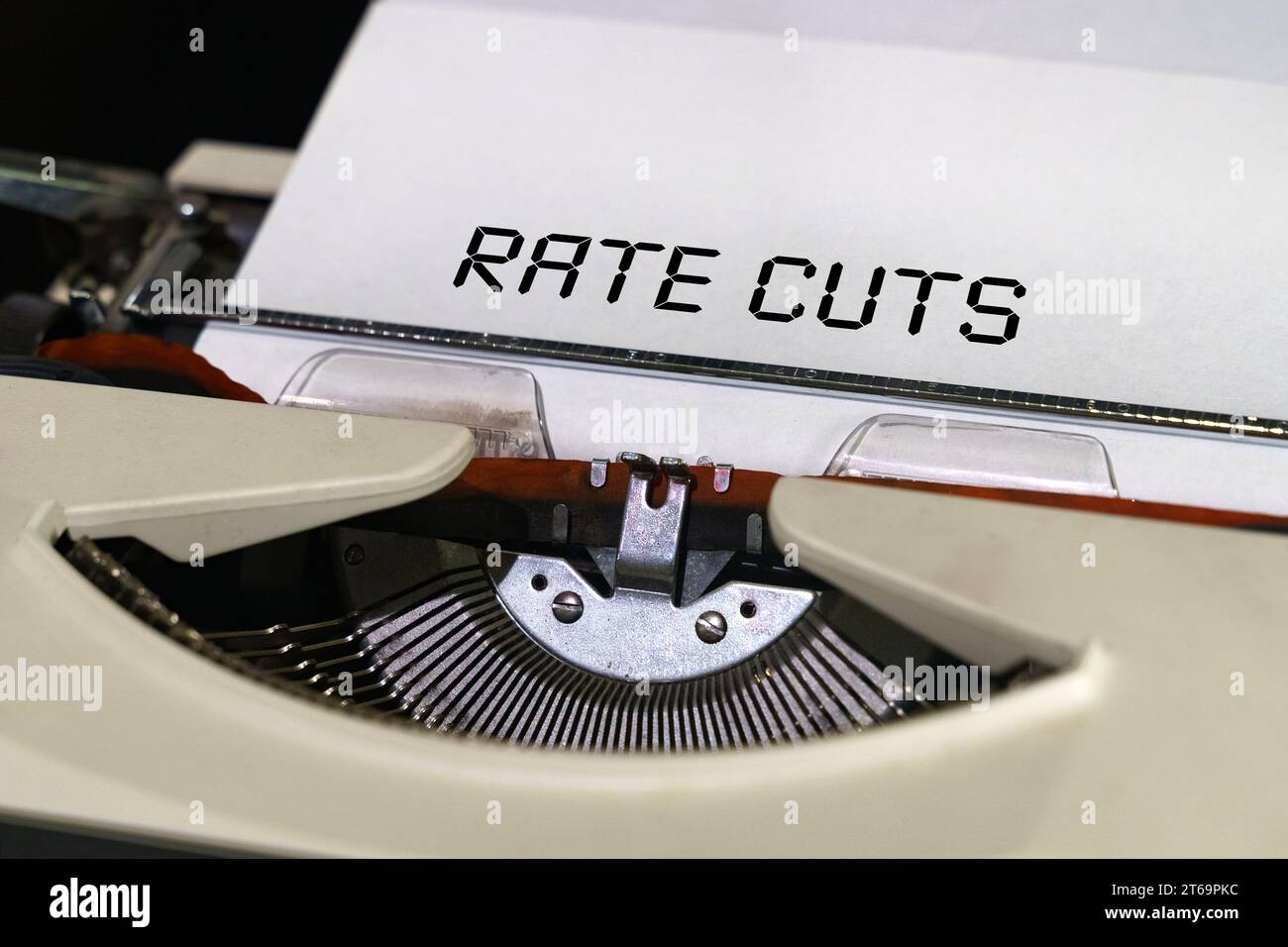 Economy and finance concept. The text is printed on a typewriter - Rate cuts Stock Photo