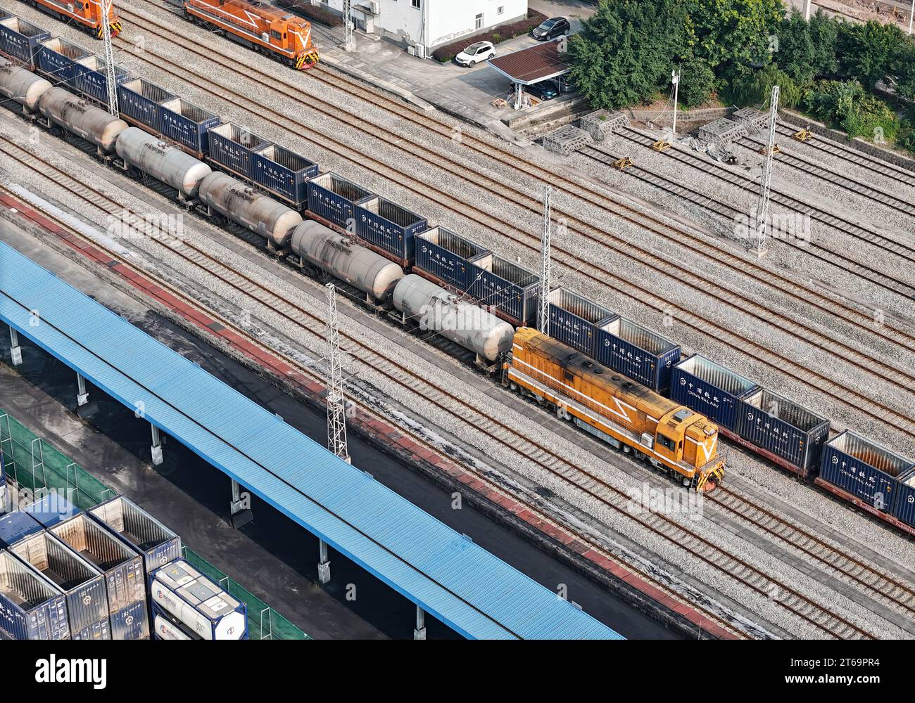 CHONGQING, CHINA - NOVEMBER 9, 2023 - A train slowly pulls out of the special railway of Changshou Economic and Technological Development Zone in Chon Stock Photo