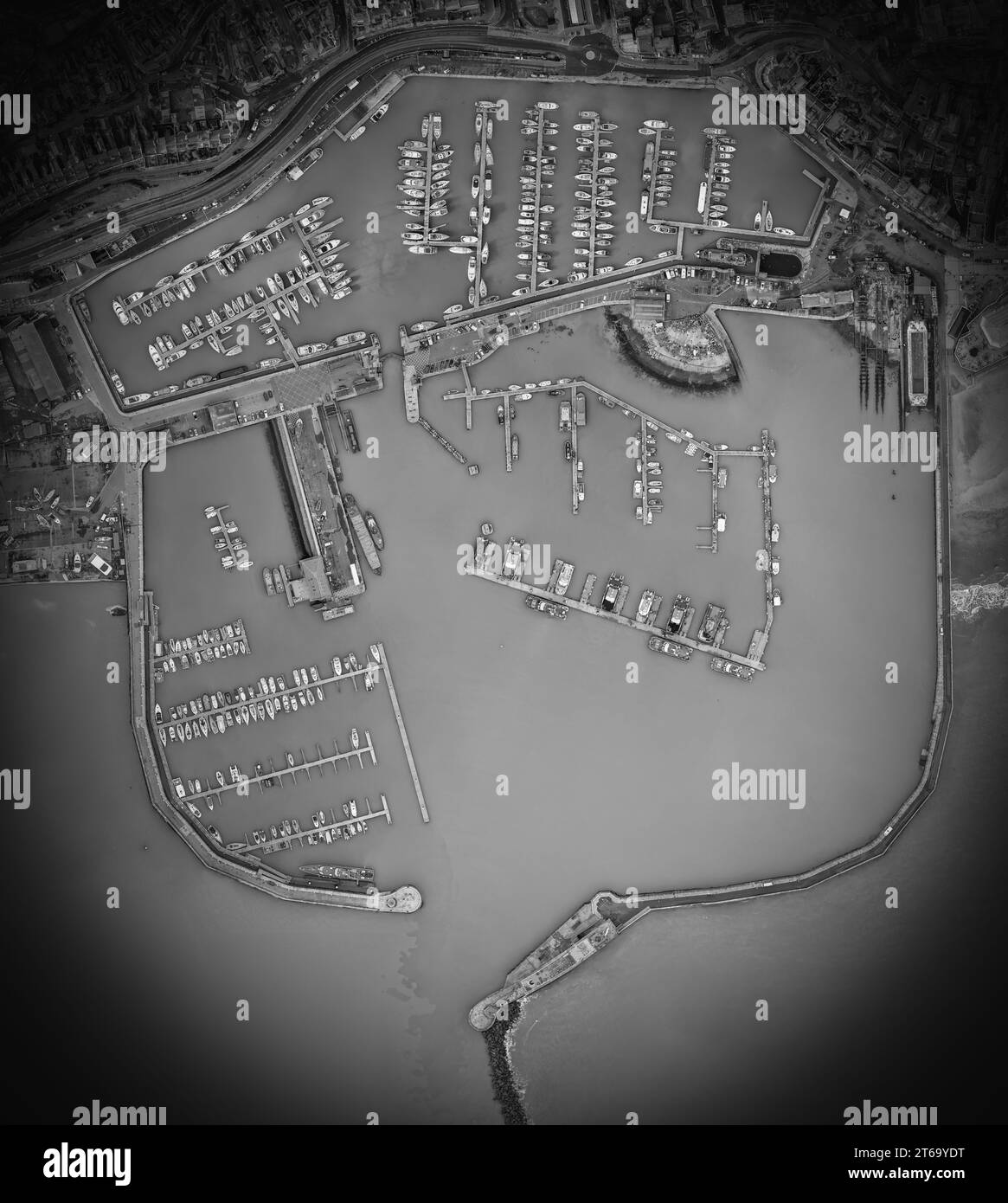 An aerial view of the Marina and Harbour with multiple moored boats ...
