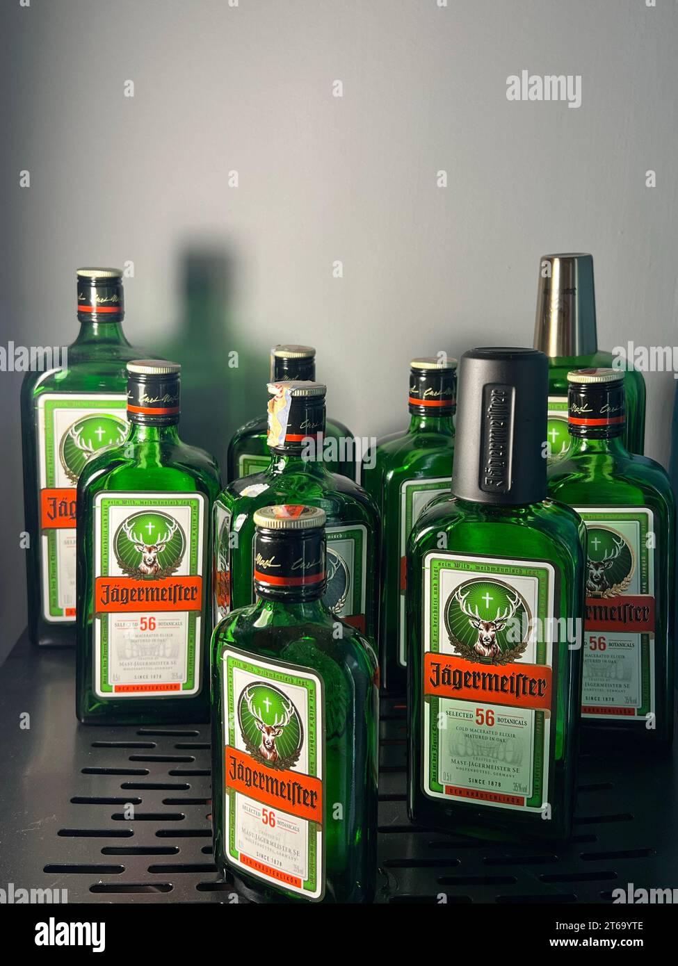 The bottles of Jagermeister spirit liqueur displayed on a black metal shelf Stock Photo Alamy