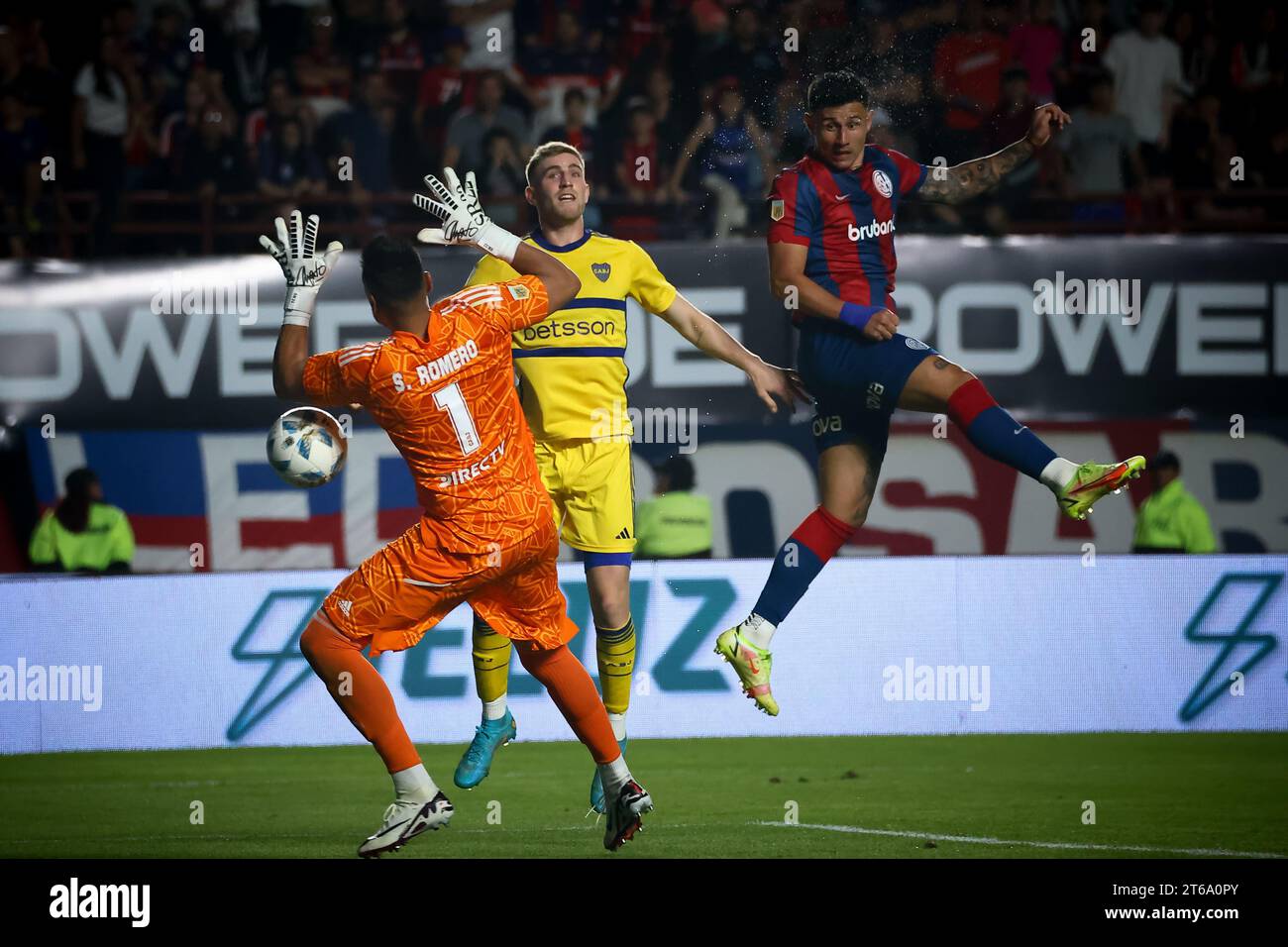 Sergio Romero (L), Nicolas Valentini of Boca Juniors (C) and Adam Bareiro of San Lorenzo (R) seen in action during the match between San Lorenzo de Almagro and Boja Juniors as part of Copa de la Liga - Fecha 12- Zona Bat Estadio Pedro Bidegain. Final Score: San Lorenzo 1 : 1 Boca Juniors. Stock Photo