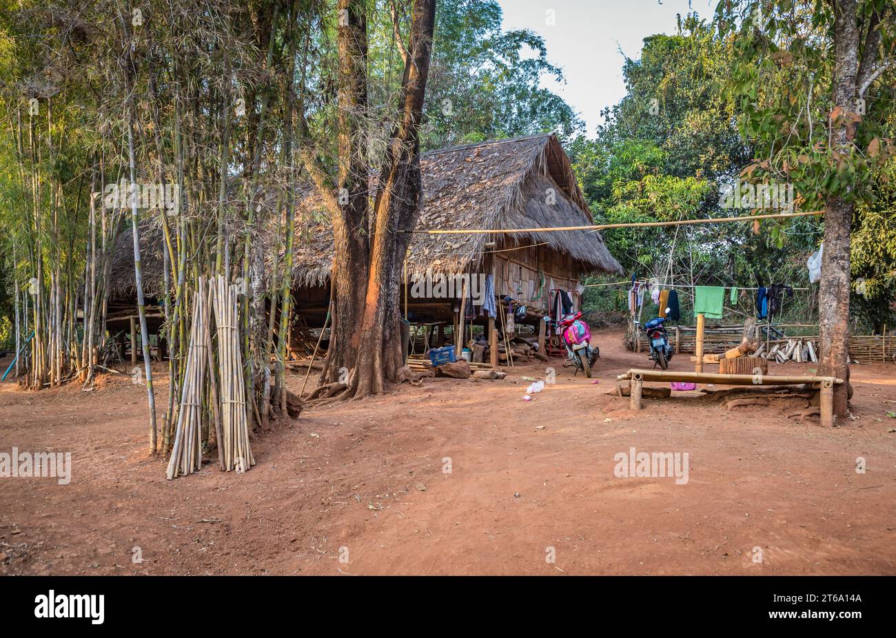 Scootors outside a hut in the Lu Mien-Yao tribe area of the Union of Hill Tribe Villages outside of Chiang Rai in the Nanglae District of Thailand Stock Photo