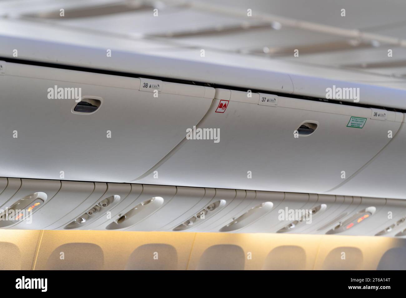 Carryon luggage in overhead storage compartment on commercial airplane