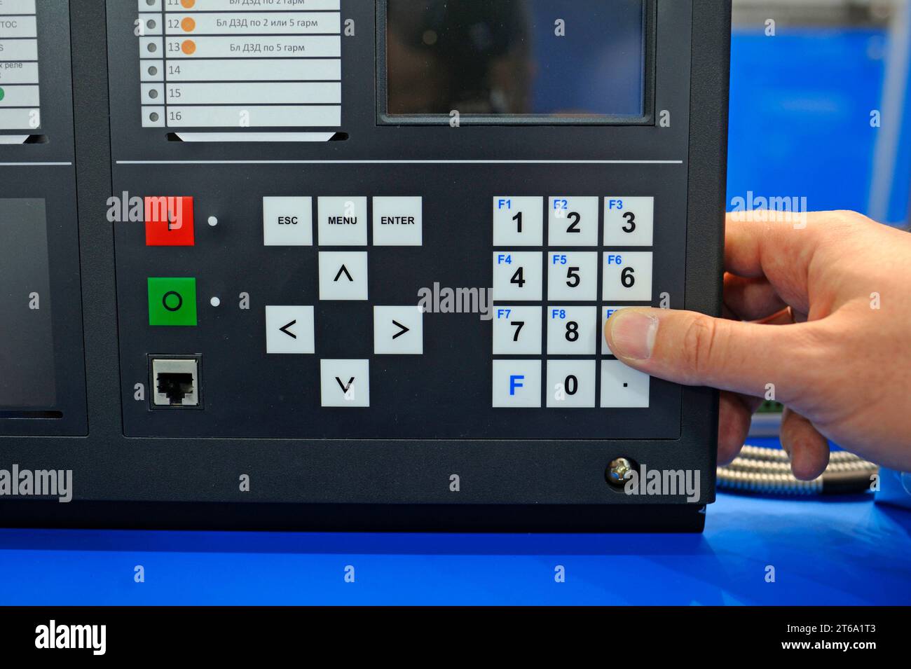 Engineer hand working with the microprocessor relay protection and