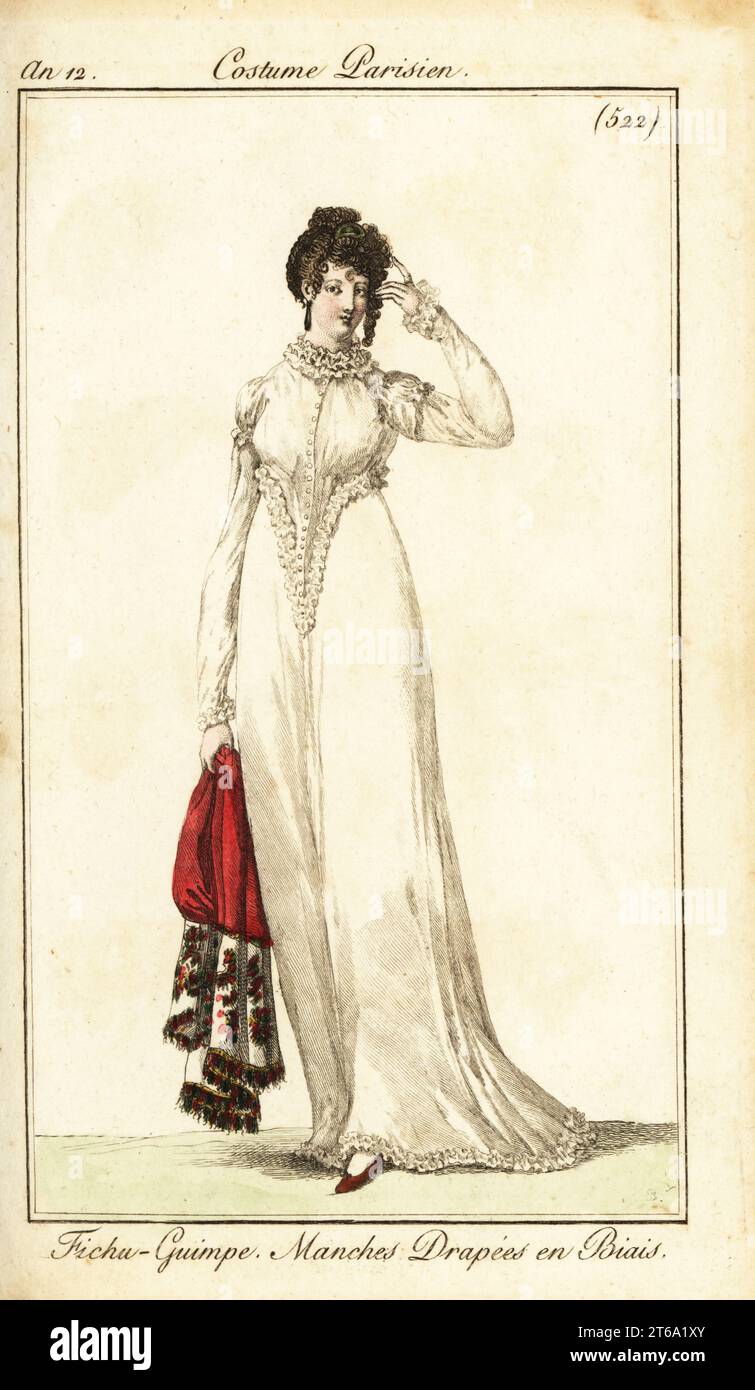 Woman with her hair tied up on the right temple. She wears a mandille corset with ruffles, bias-cut sleeves, and carries an embroidered shawl. Fichu-Guimple, Manches Drapees en Biais. Handcoloured copperplate engraving from Pierre de la Mesangeres Journal des Dames et des Modes, Magazine of Women and Fashion, Paris, An 12, January 1804. Illustrations by Carle Vernet, Jean-Francois Bosio, Dominique Bosio and Philibert Louis Debucourt, engraved by Pierre-Charles Baquoy. Stock Photo