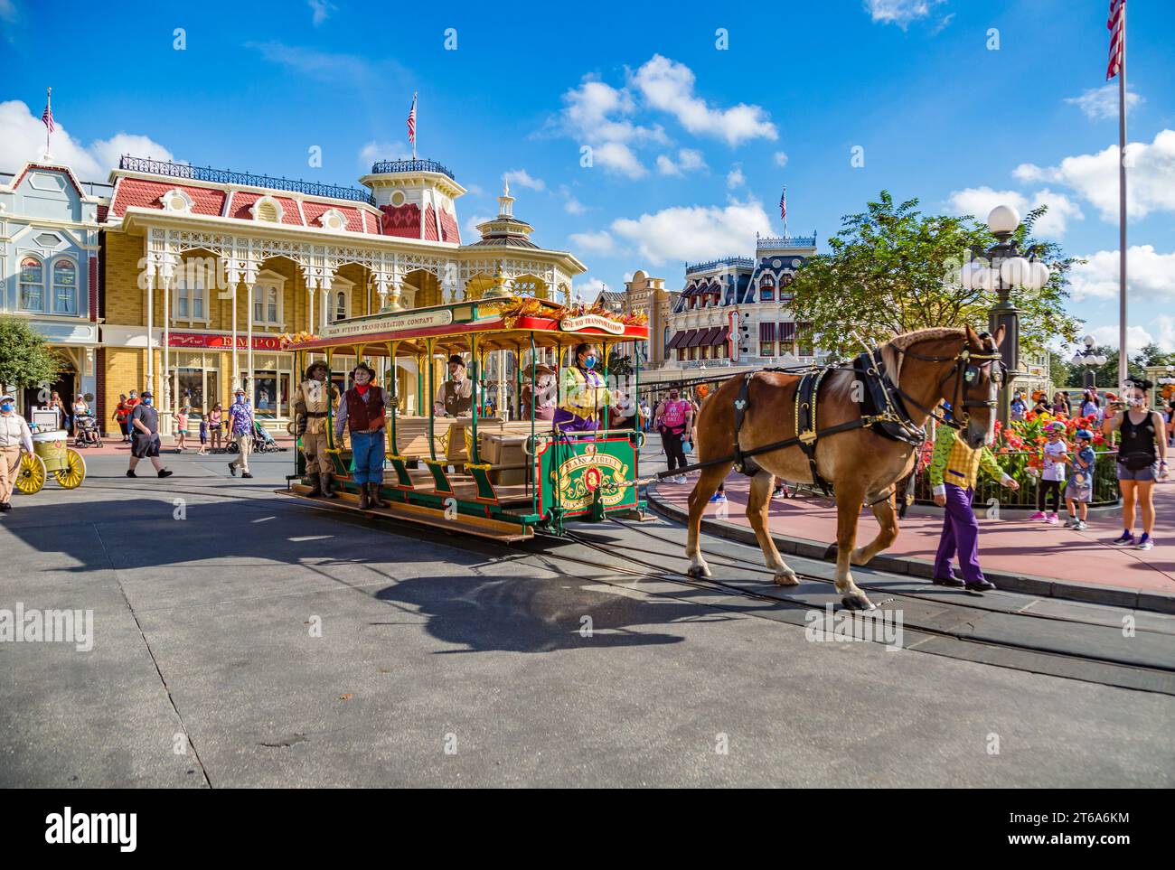 Horse pulling trolley car with Disney characters down Main Street in the Magic Kingdom at Walt Disney World, Orlando, Florida Stock Photo