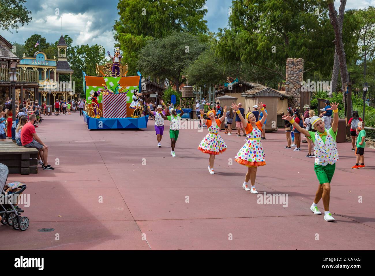 Parade of dancers and characters in the Frontierland area of Magic ...