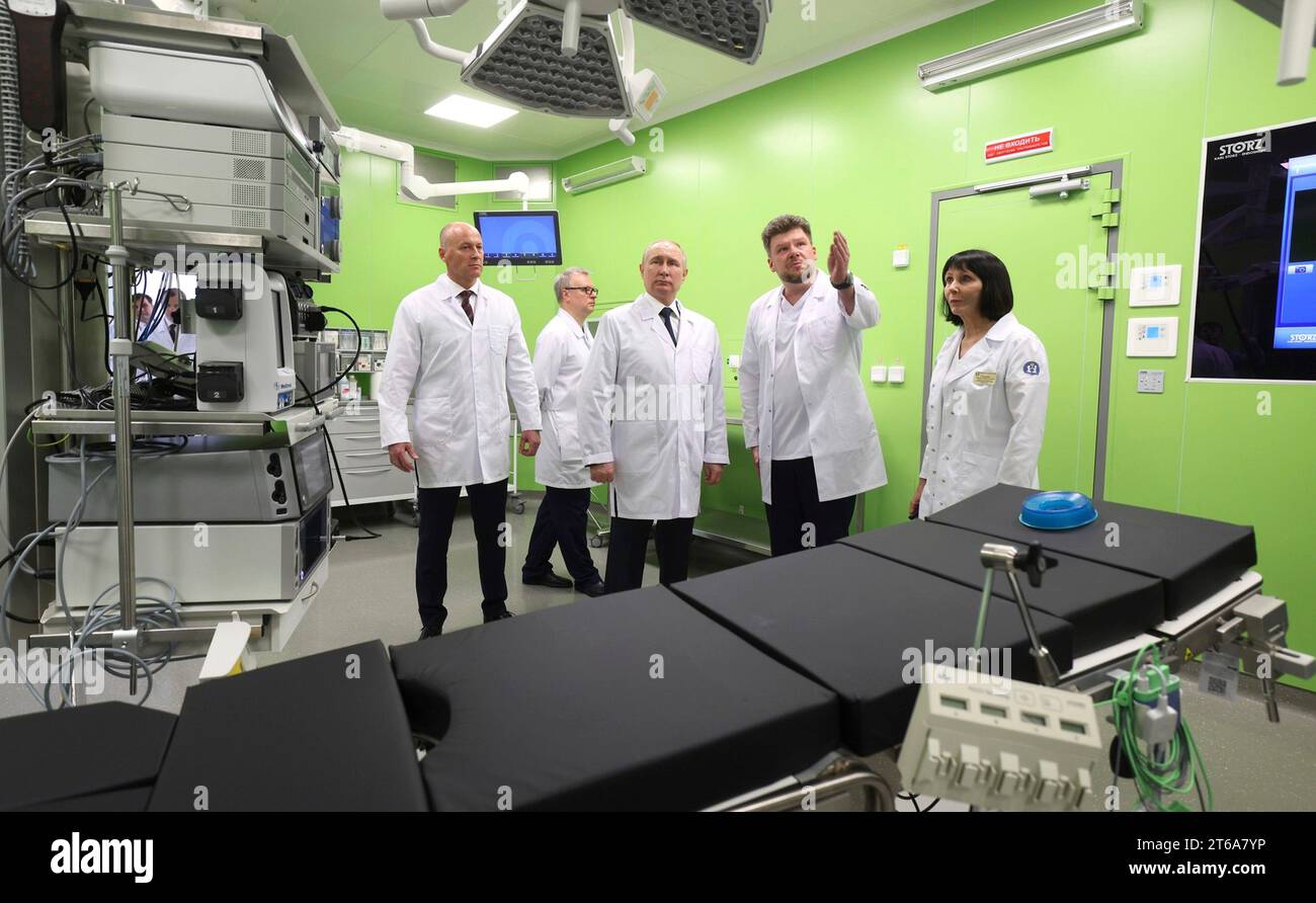 Moscow, Russia. 08th Nov, 2023. Russian President Vladimir Putin, center, wearing a lab coat, tours advanced medical facilities of the Dmitry Rogachev National Research Center of Pediatric Hematology, Oncology and Immunology, November 8, 2023 outside Moscow, Russia. Standing from left: Deputy Healthcare Minister Viktor Fisenko, Chief Physician Dmitry Litvinov, President Vladimir Putin, and Director-General Galina Novichkova. Credit: Gavriil Grigorov/Kremlin Pool/Alamy Live News Stock Photo