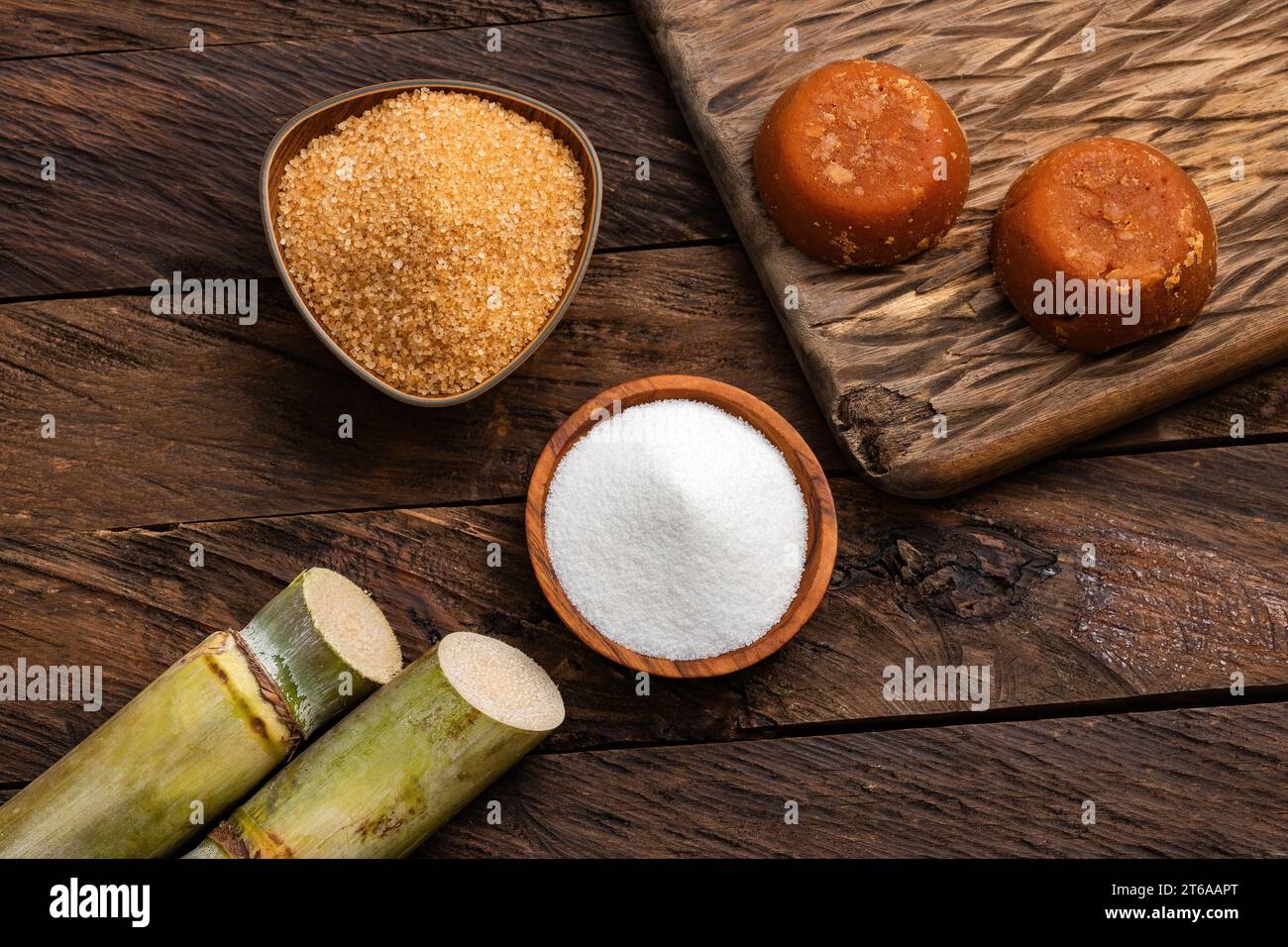Panela, brown and white sugar with the stems of sugar cane - Saccharum officinarum Stock Photo