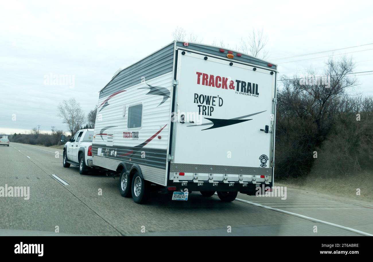 Track & Trail travel trailer on it's way to a camping destination. Highway 94 Wisconsin WI USA Stock Photo
