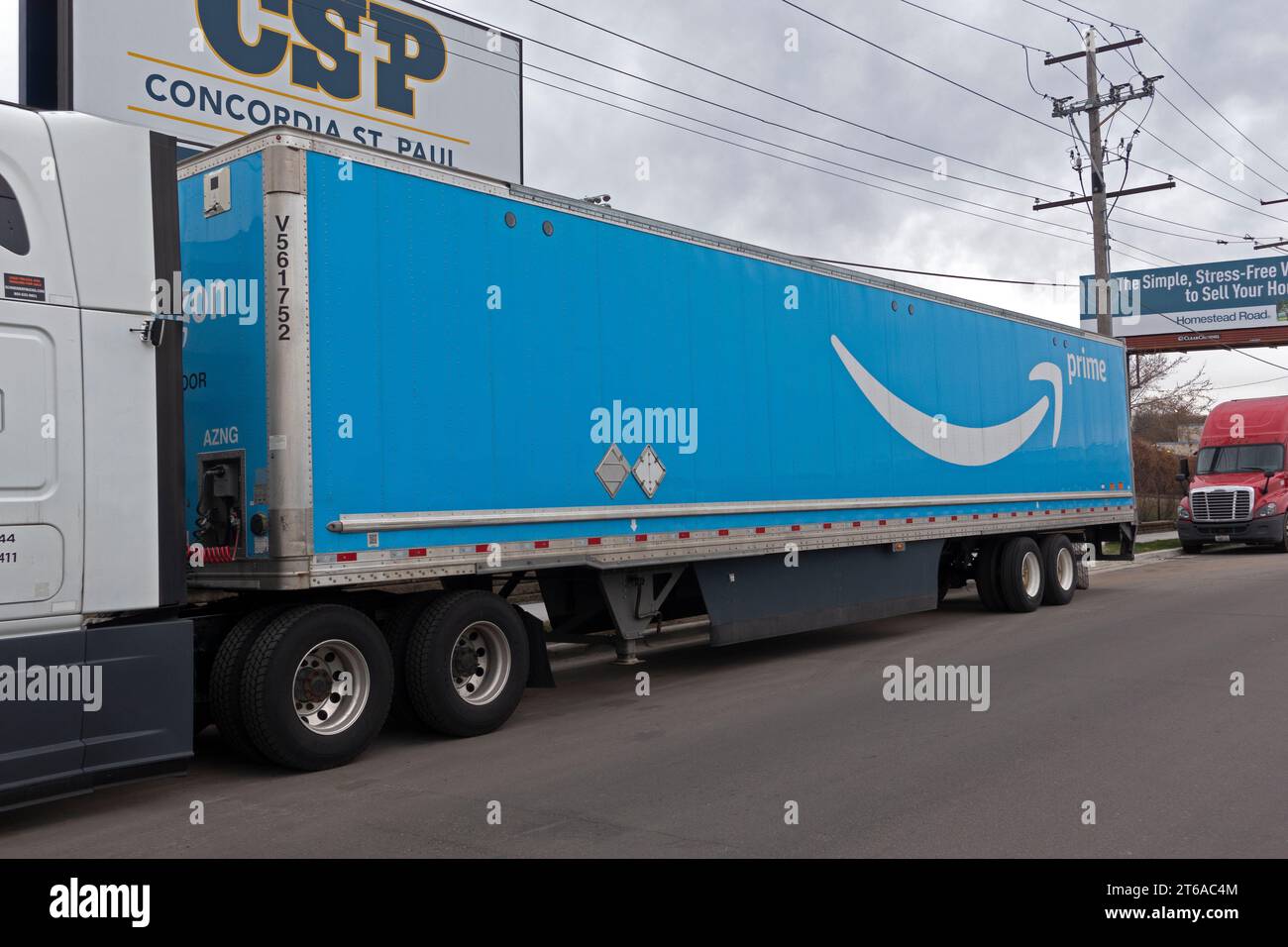 Blue Prime Amazon semi delivery truck parked on side of highway. St
