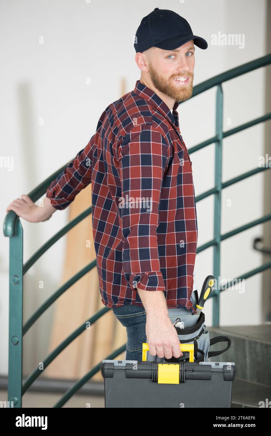 happy young man with long beard smiling at camera Stock Photo