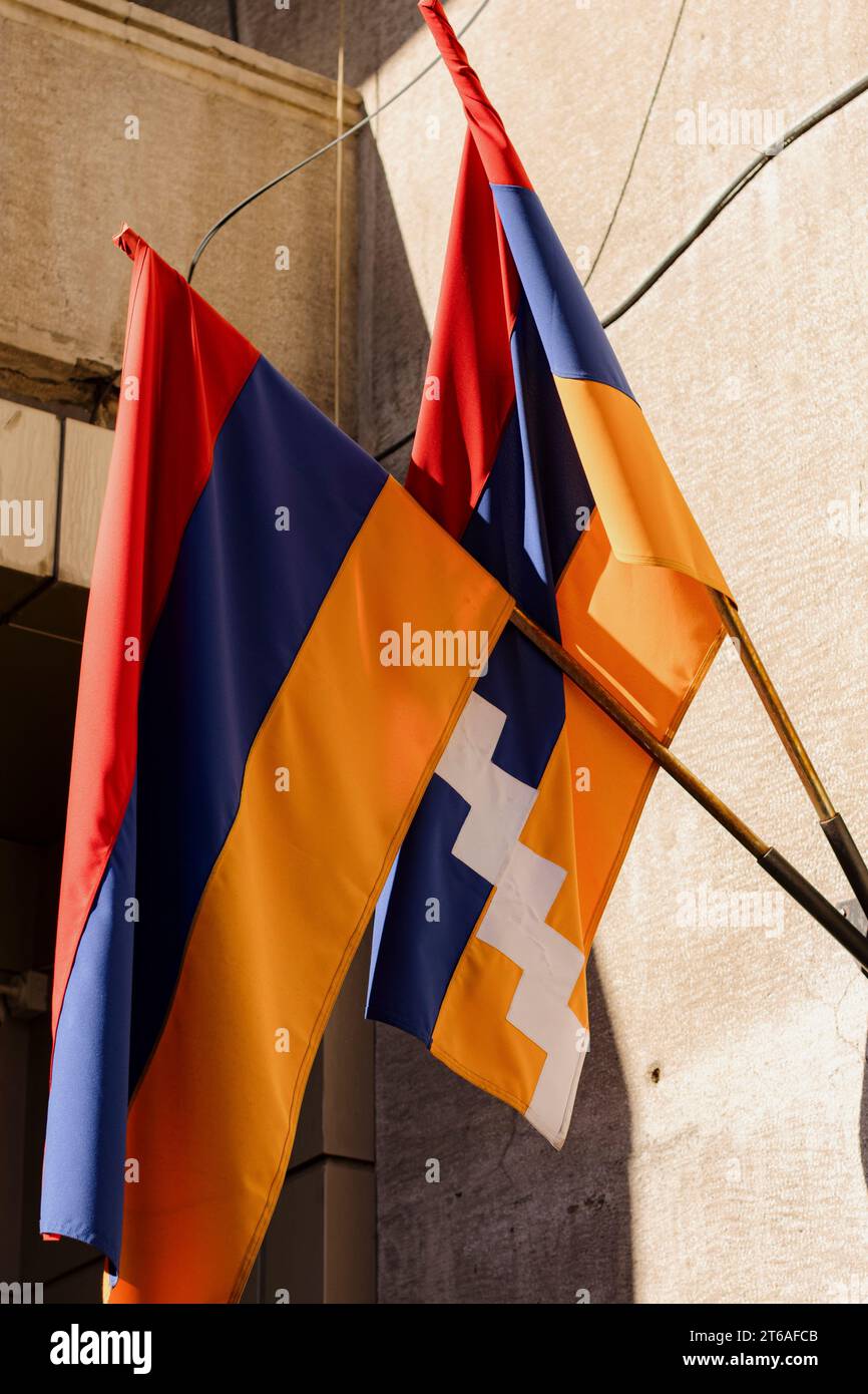 Flags Of Armenia And Artsakh Displayed On A Tall Pole In Front Of A 