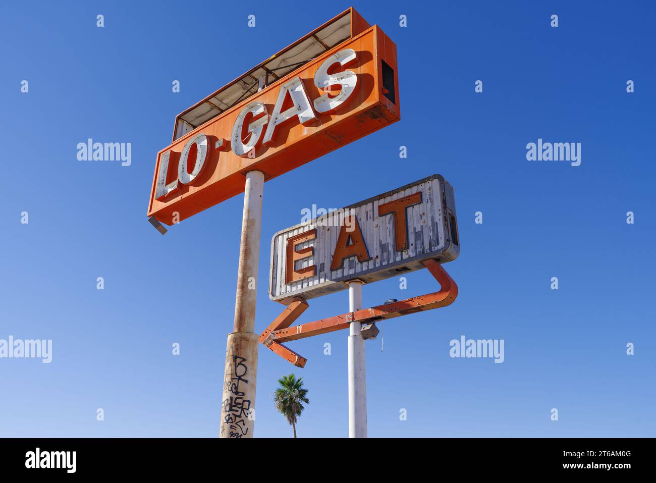 Abandoned gas station and restaurant signs shown along the I15 in