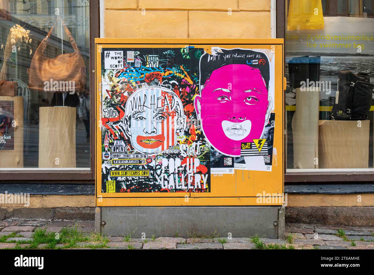 Street art posters on a electrical cabin advertising Scott Caris exhibition in Helsinki, Finland Stock Photo